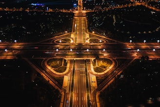 A bustling urban intersection with AI-powered traffic lights and sensors managing flow efficiently.
