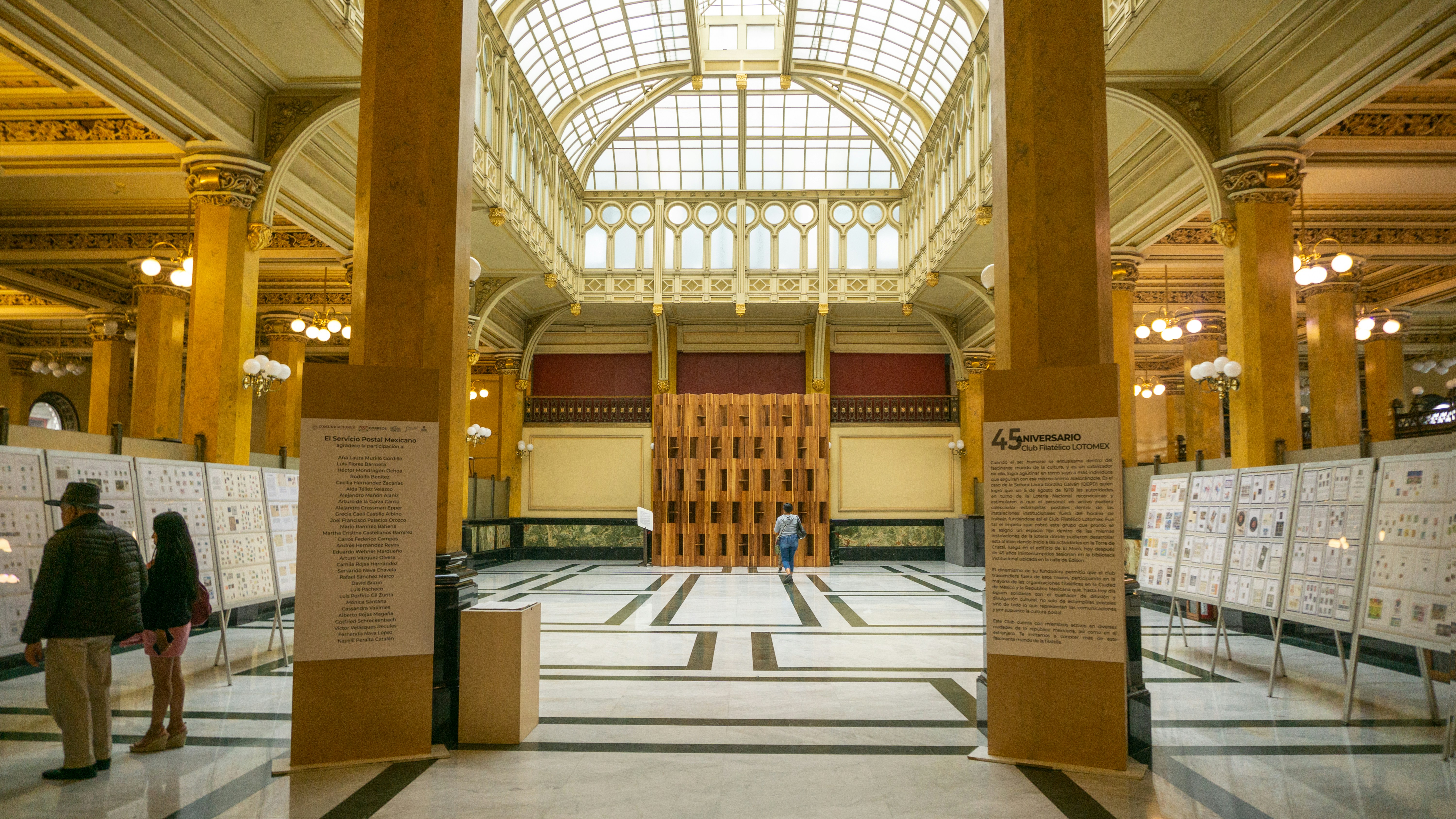 a couple of people that are standing in a building