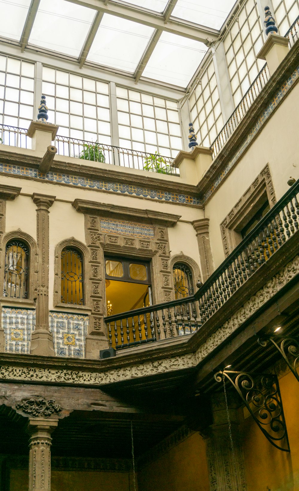 a building with a glass roof and a balcony