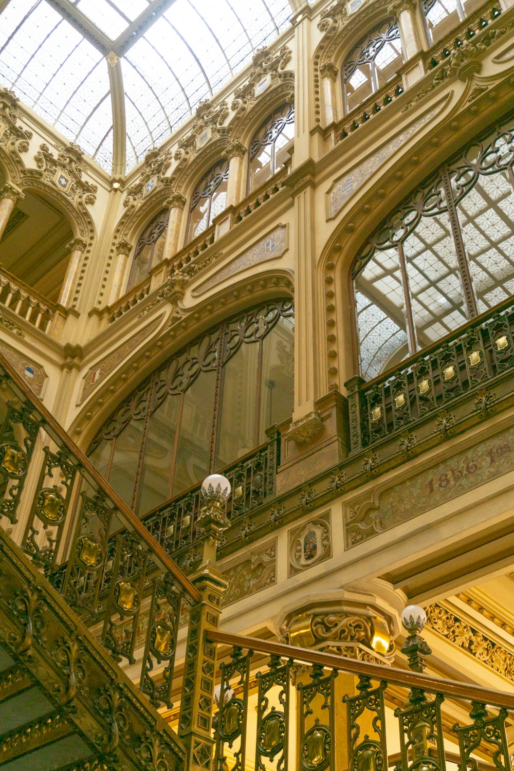 a staircase in a building with a skylight above it