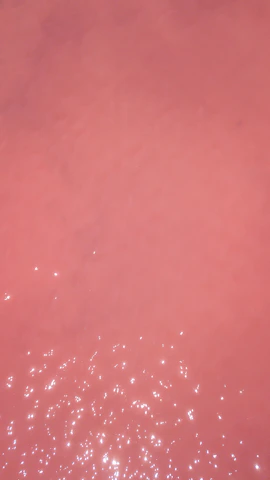 A soft blush pink abstract texture with subtle champagne highlights, evoking minimalist luxury and femininity.