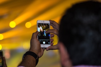 A close-up of a camera capturing a vibrant video shoot.