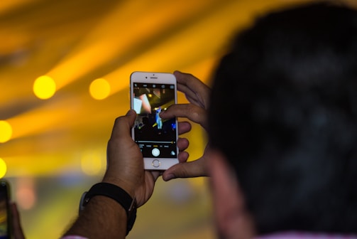 Close-up of a person filming a product with a smartphone.