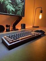 a computer keyboard sitting on top of a desk