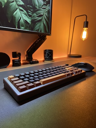 a computer keyboard sitting on top of a desk