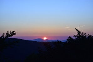 Sunset view over the rolling hills visible from Sítio Santa Helena