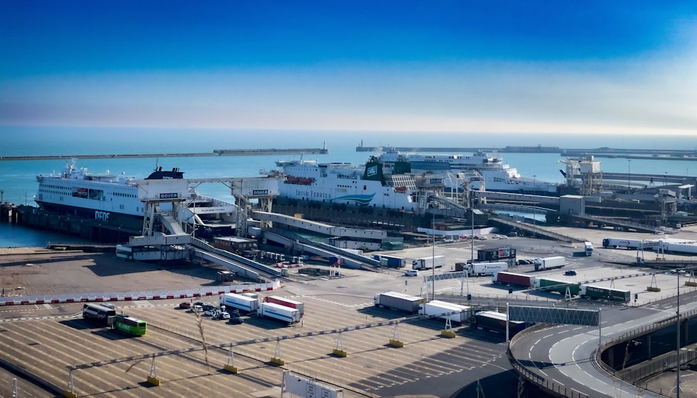 a harbor filled with lots of boats next to a large body of water