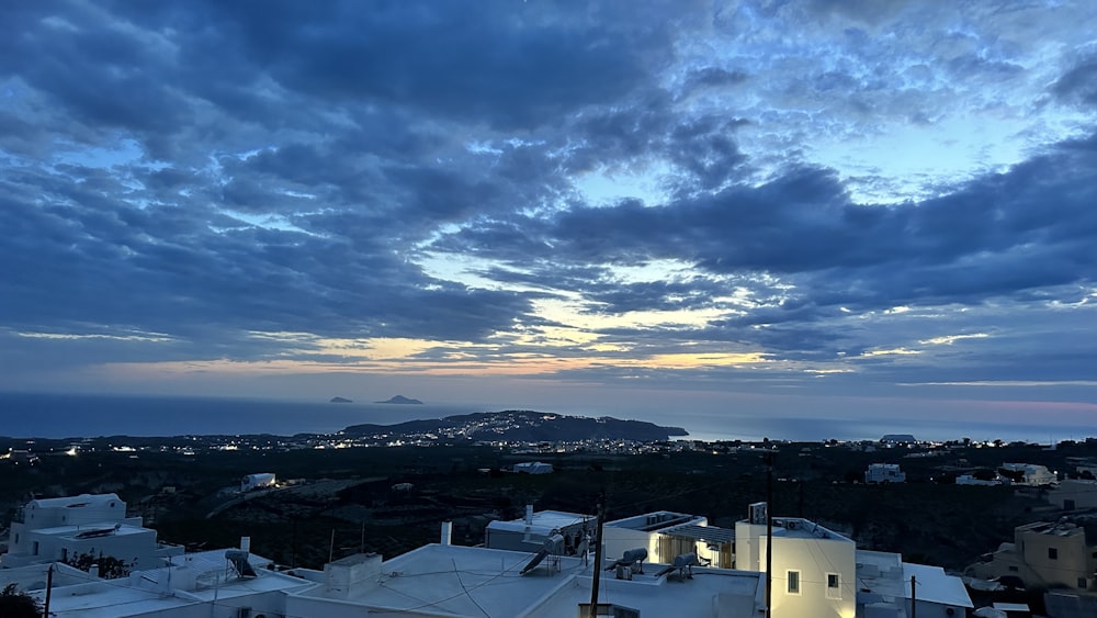 a view of a city at dusk from a rooftop