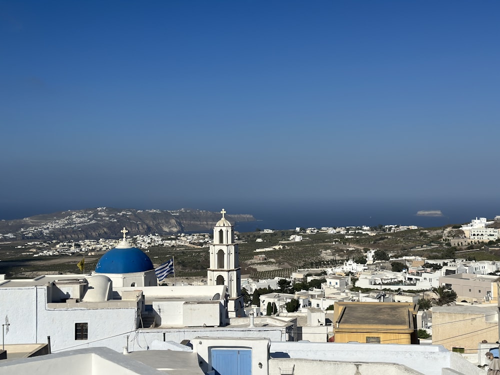 a view of a city with a blue dome