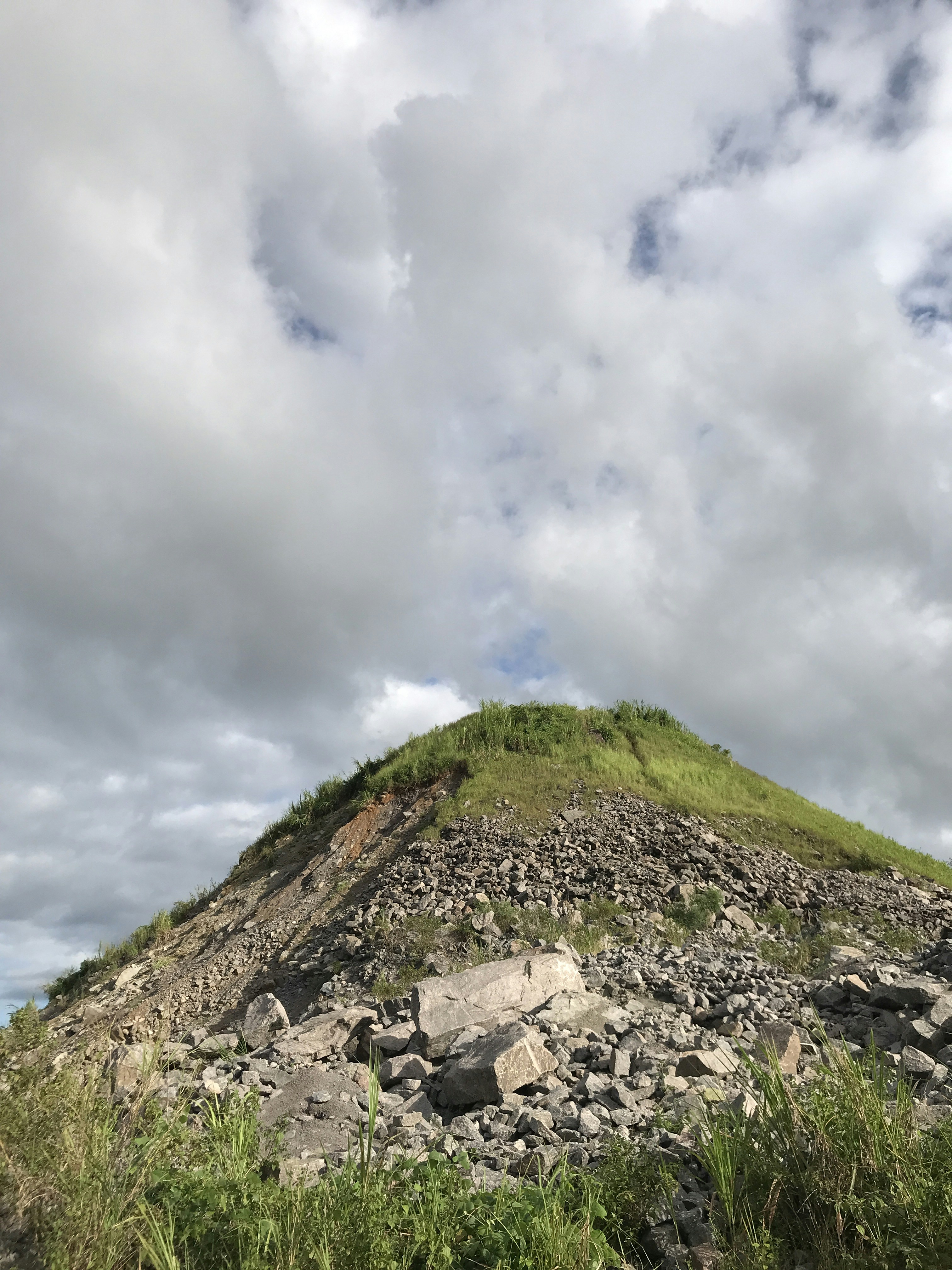 a large mound of rocks on top of a hill