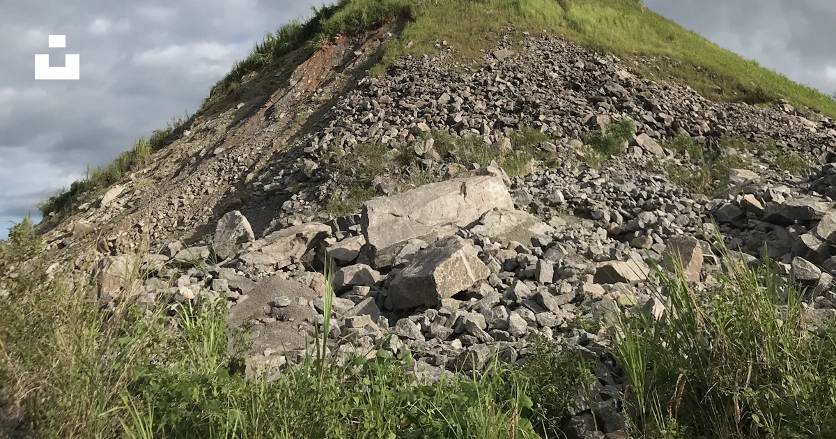 Moud Rocks A large mound of rocks on top of a hill photo – Free Field Image on ...