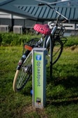 An electric bike charging at a public station.