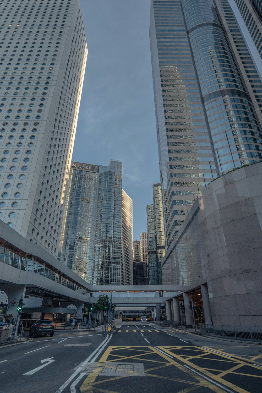 a city street with tall buildings in the background