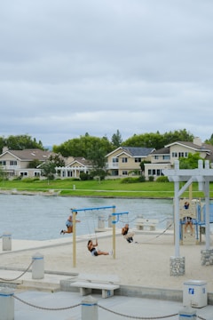 Children playing in a clean village playground with healthy surroundings.