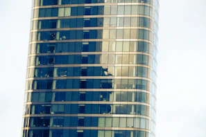 Completed commercial office space with glass facade reflecting the cityscape