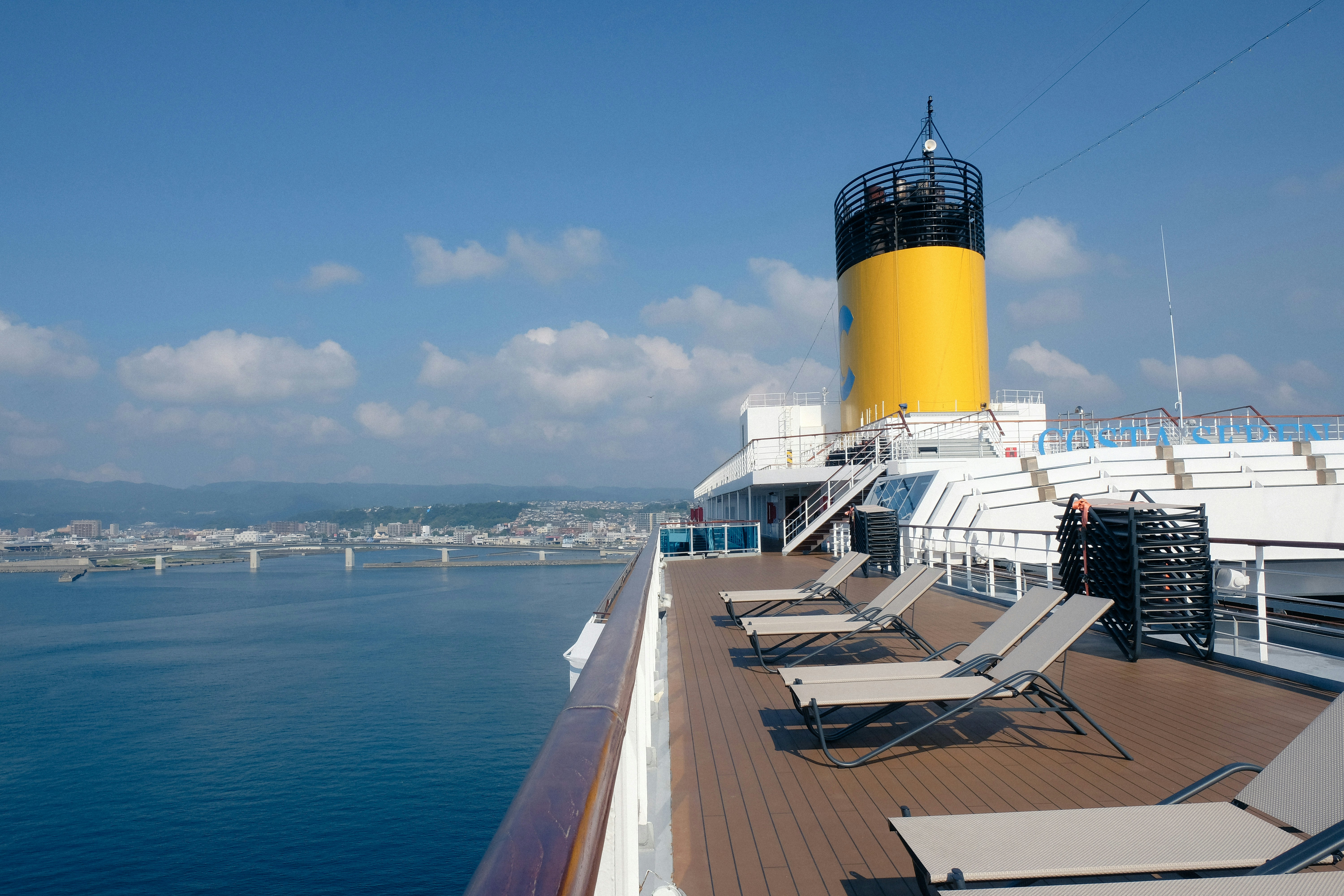 lounge chairs on the deck of a cruise ship, 