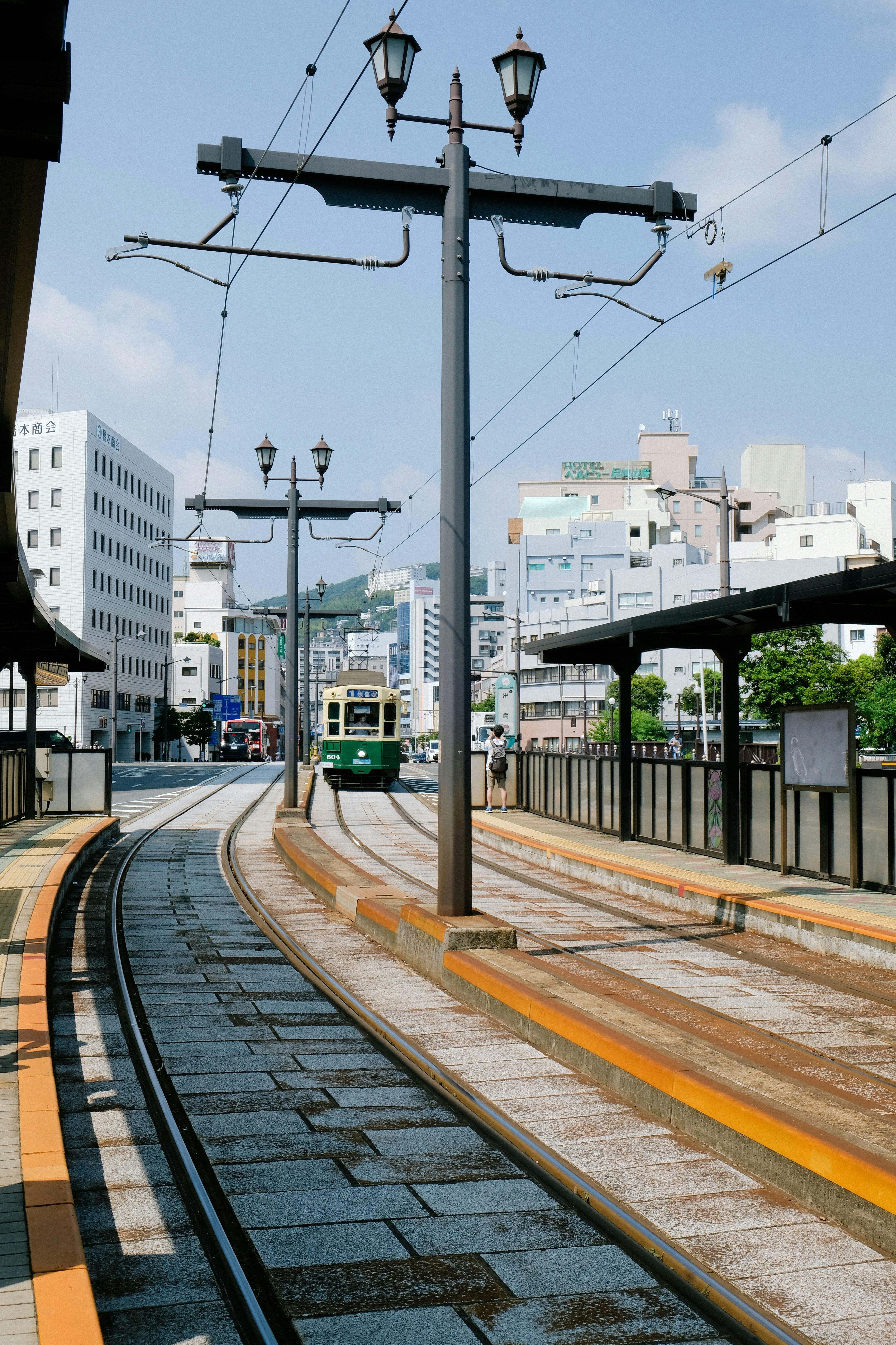 a train on a train track in a city