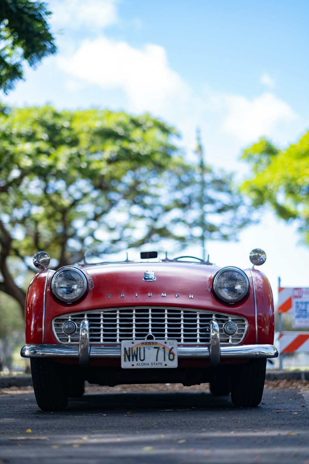 a red car parked on the side of the road