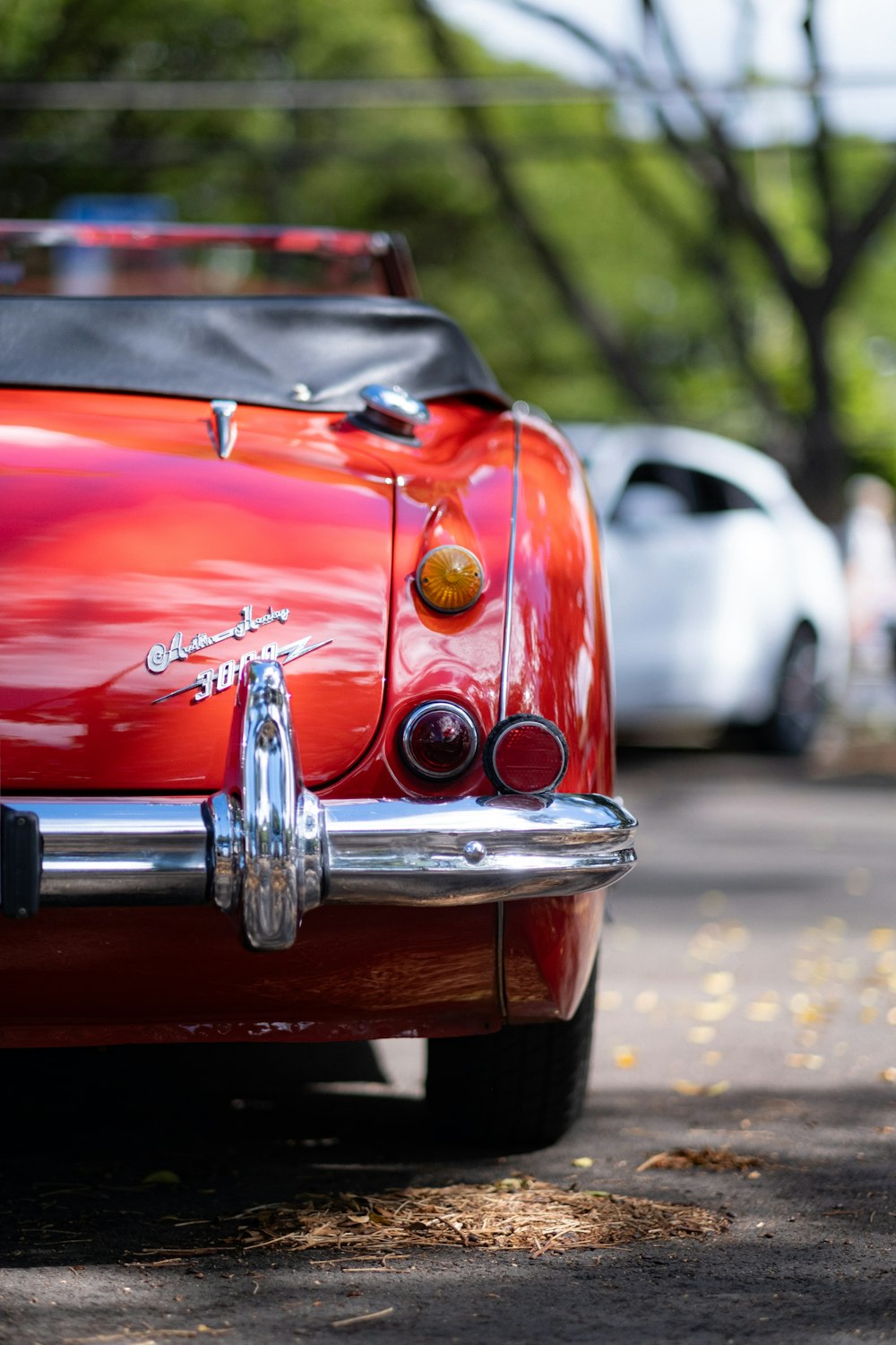 a red car parked on the side of the road