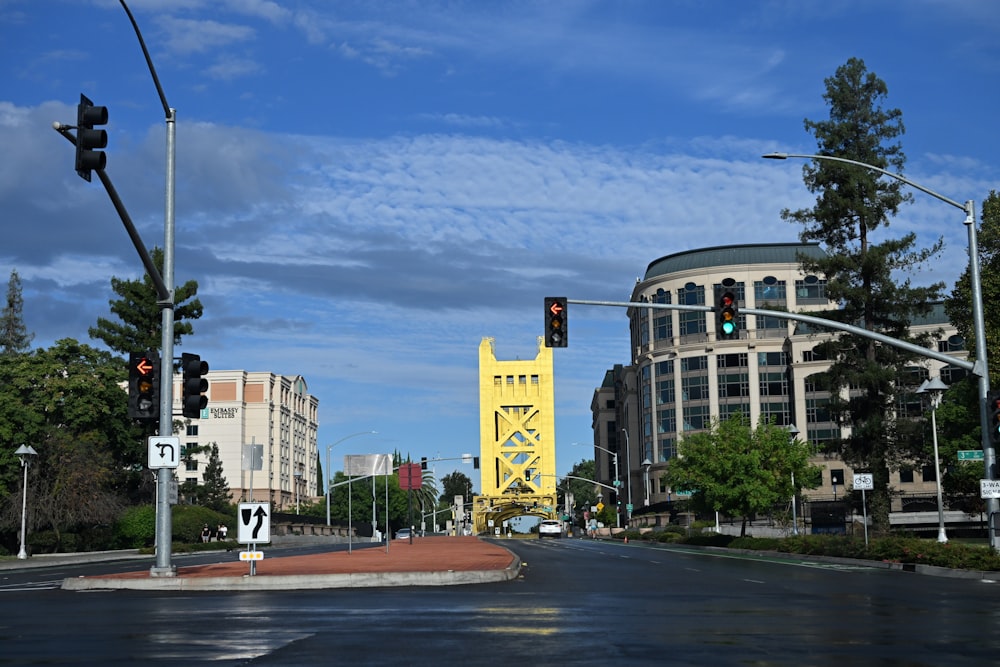 a traffic light on a city street with buildings in the background