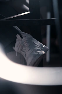 Close-up of a limited-edition streetwear collectible with intricate details under moody lighting