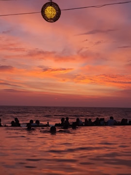 An influencer capturing a stunning sunset at a luxury resort, with engagement stats overlay.