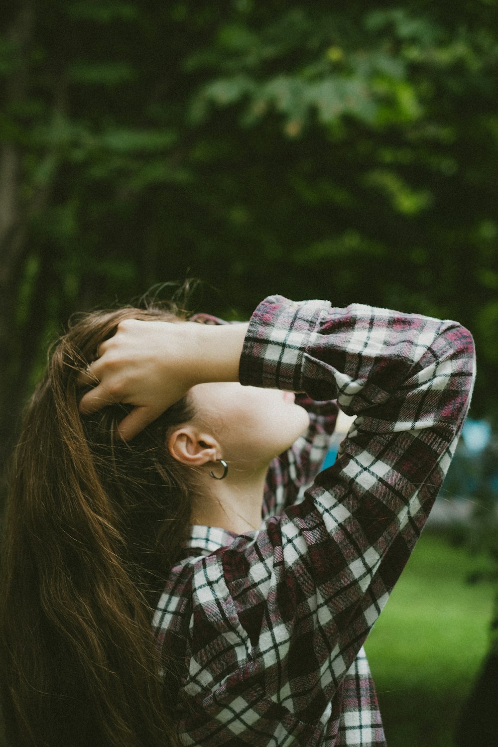 a woman with her hair in the wind