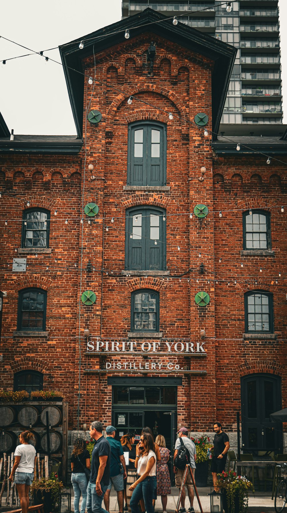 a group of people standing outside of a building