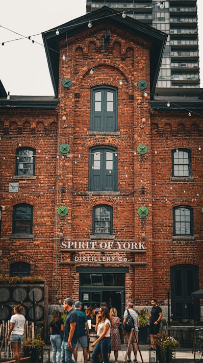 a group of people standing outside of a building
