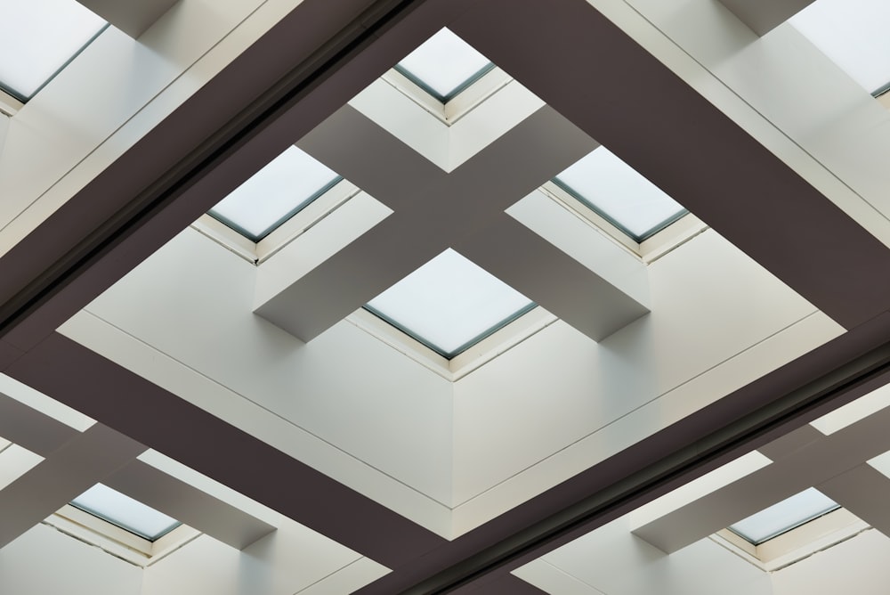 the ceiling of a building with a skylight in it