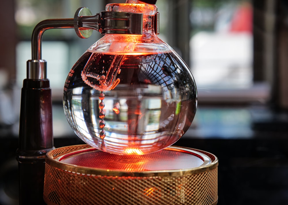 a water dispenser with a red light inside of it