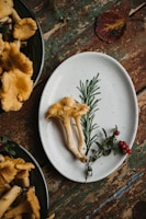 Close-up of a rustic table set with regional dishes featuring mushrooms and fermented delicacies