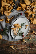 Close-up of fresh onions and oyster mushrooms arranged on a rustic wooden table.