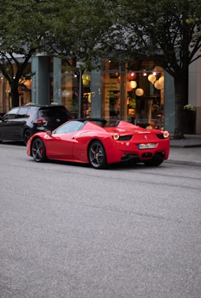 A sleek Japanese car on a city street during daylight.