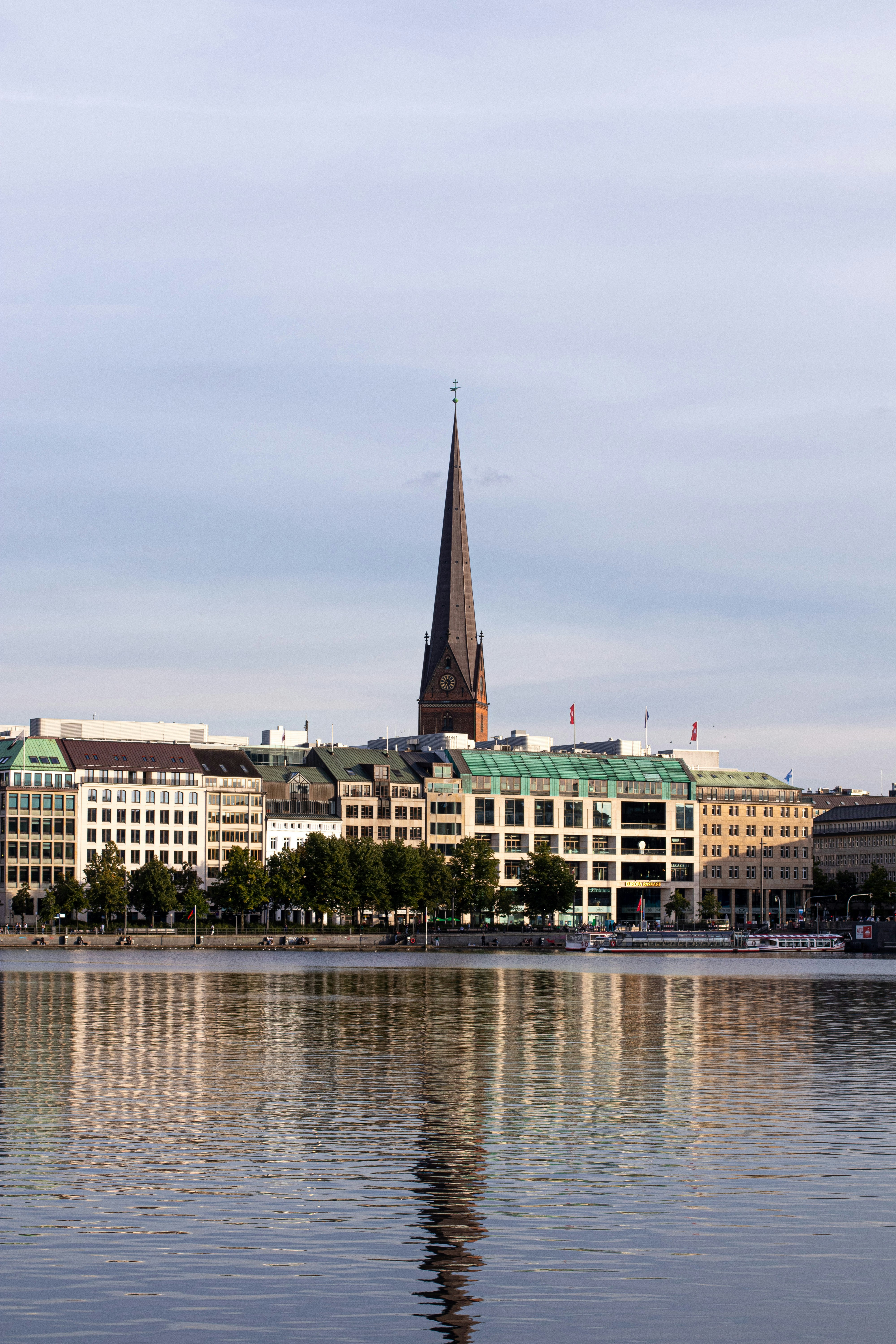 a large body of water with buildings in the background