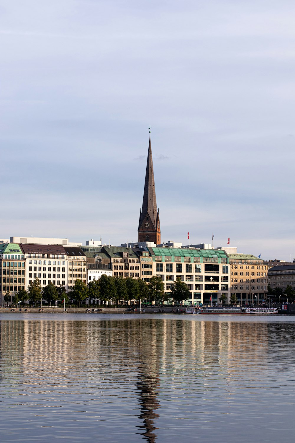 a large body of water with buildings in the background