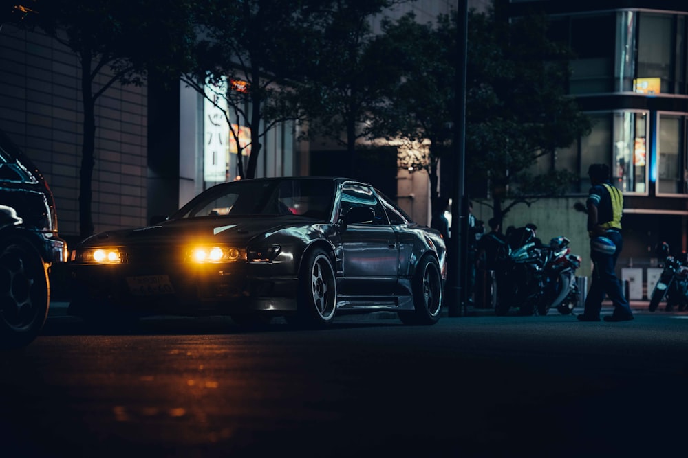 two cars parked next to each other on a street