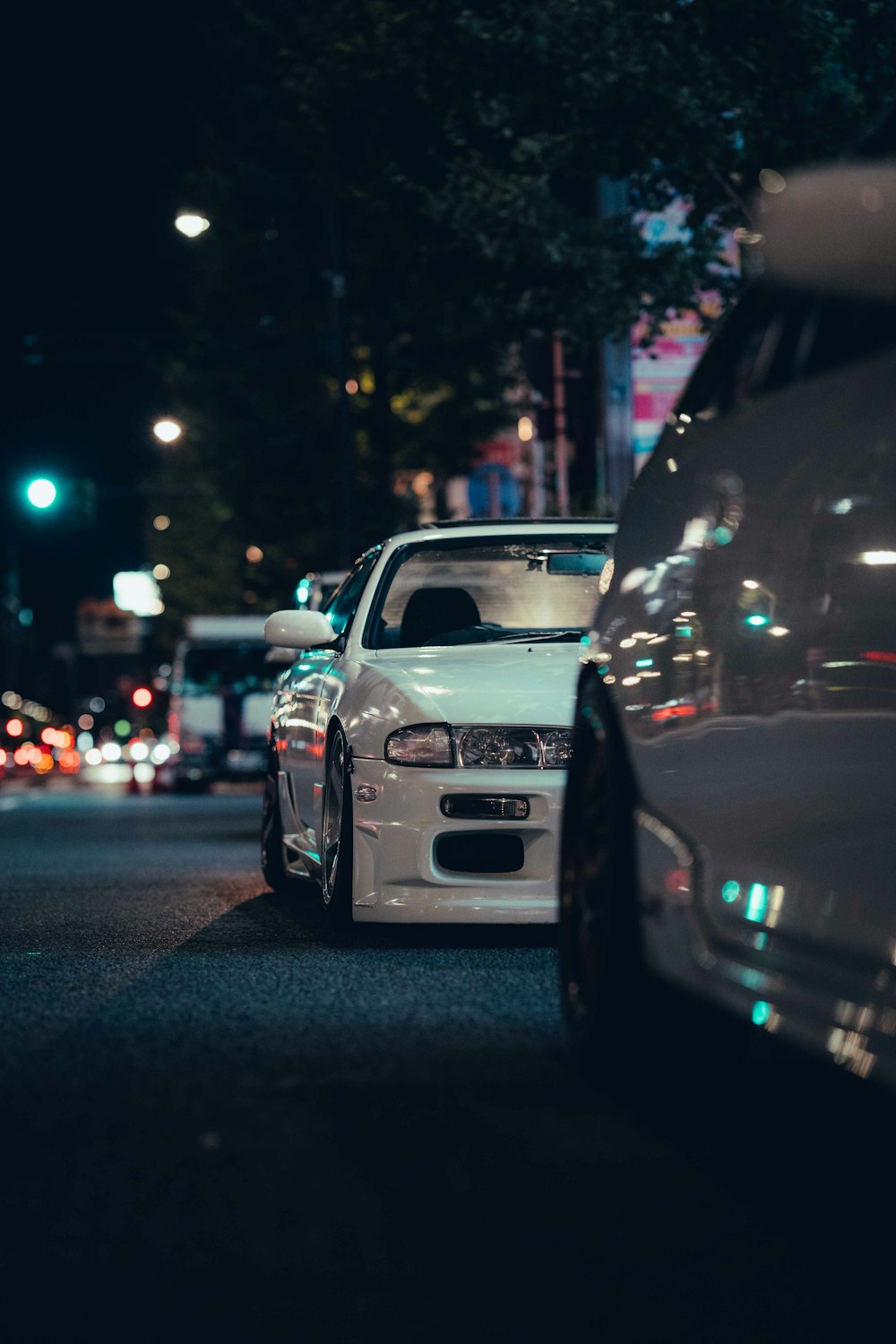 a couple of cars that are sitting in the street