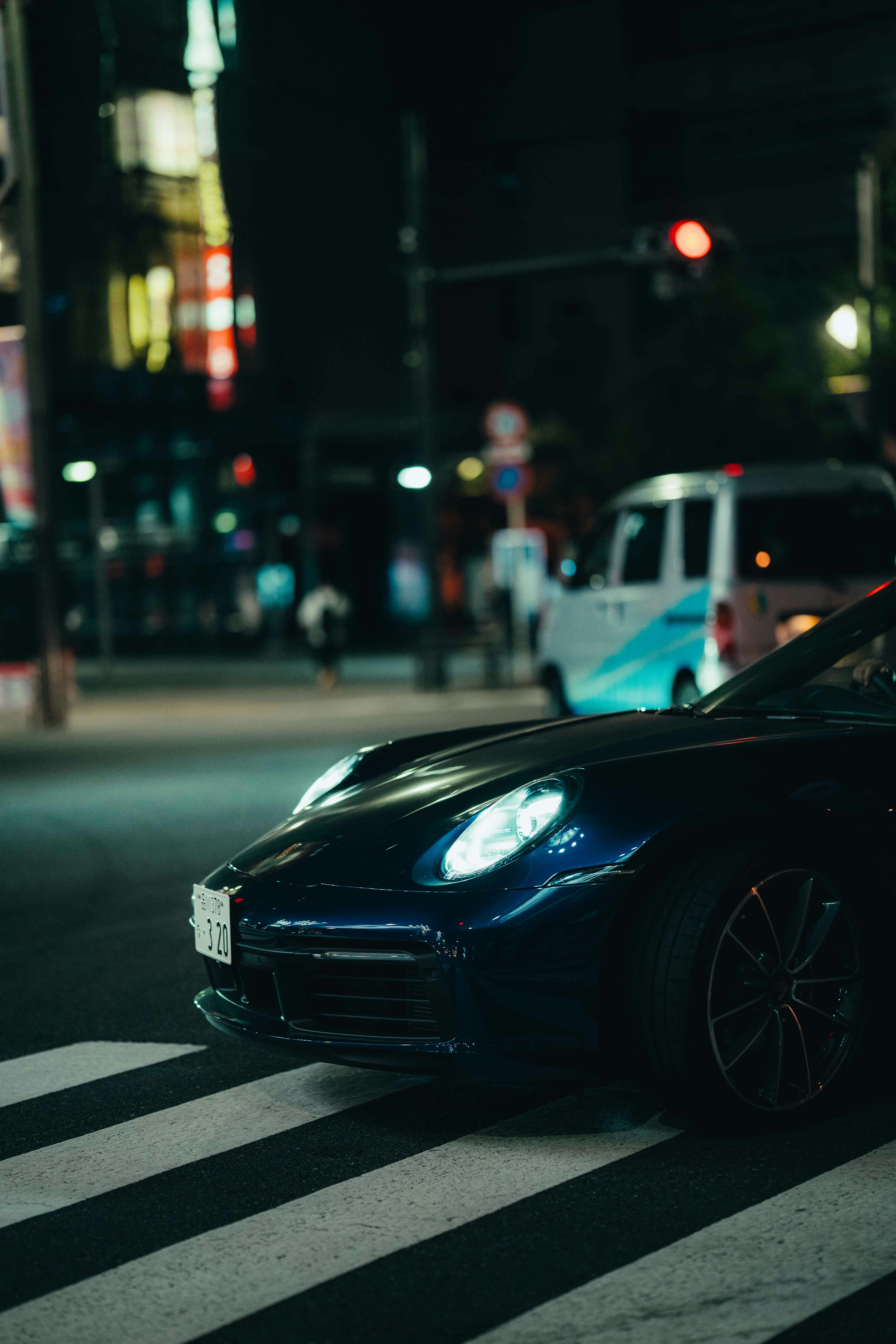 a black sports car parked on the side of the road