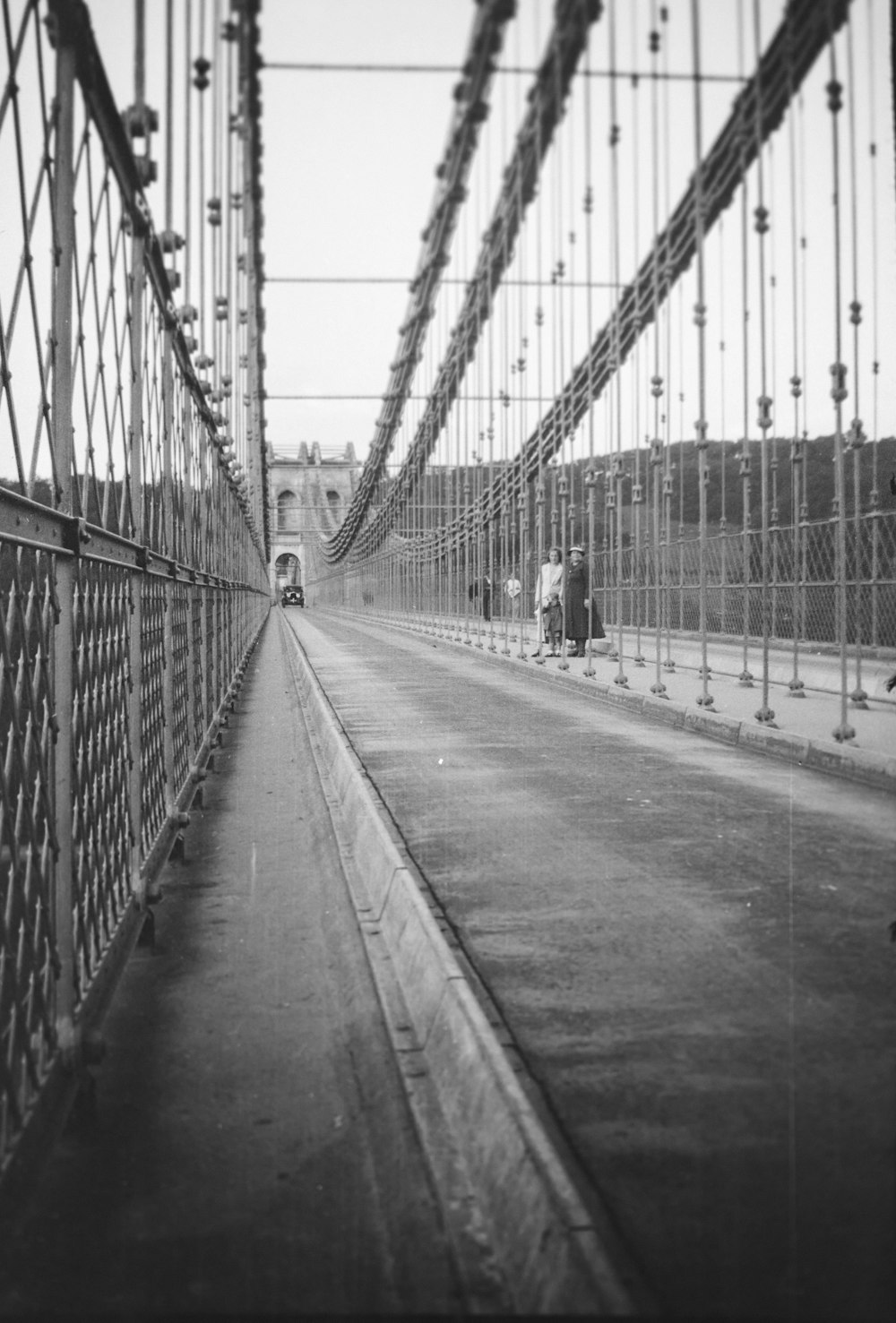 a black and white photo of a bridge