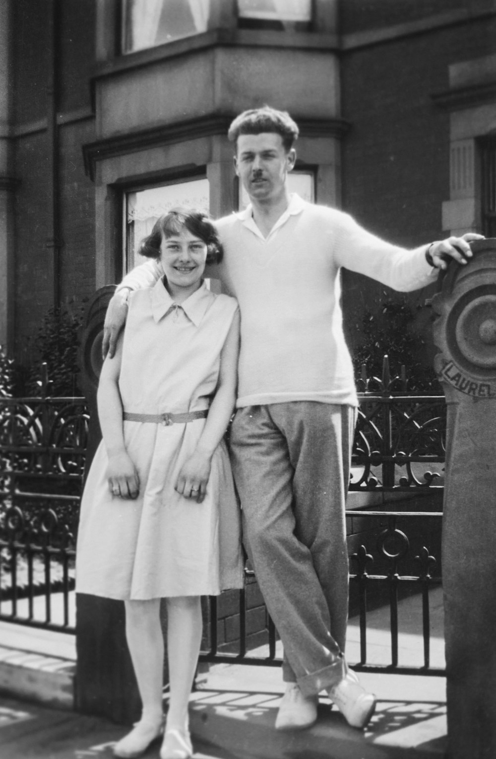 a black and white photo of a man and a woman