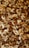 A close-up view of a variety of mixed nuts, including almonds, cashews, walnuts, and Brazil nuts. The assortment shows an appealing mixture of shapes, sizes, and textures, highlighting their natural tones and slightly oily surfaces.