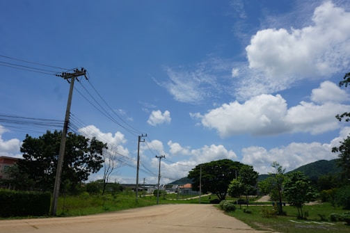 Electric distribution lines stretching across a rural area.