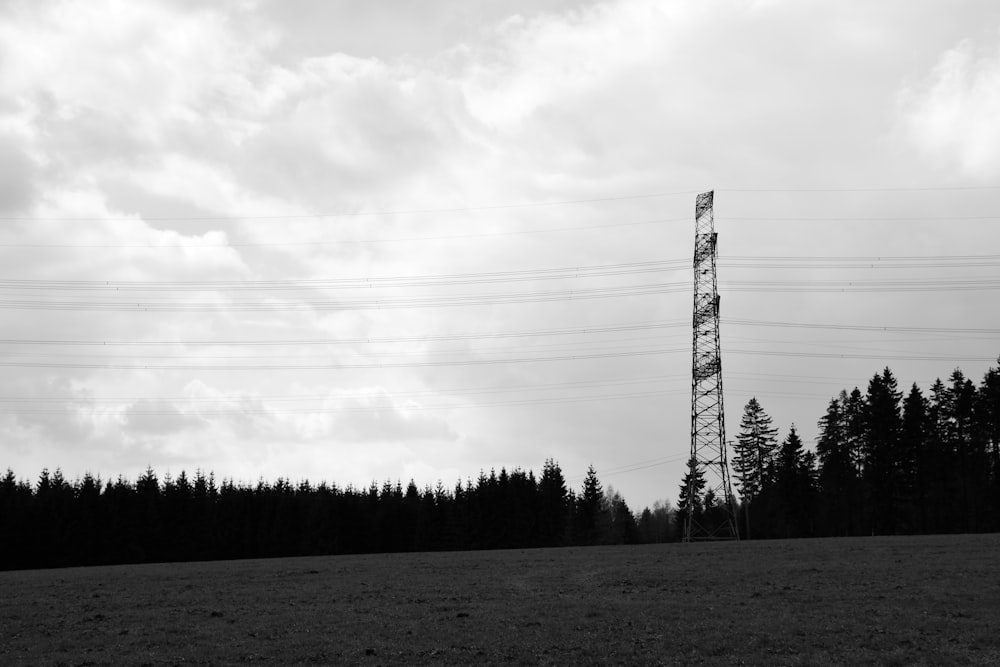a black and white photo of a telephone tower
