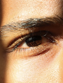 a close up of a person's brown eye