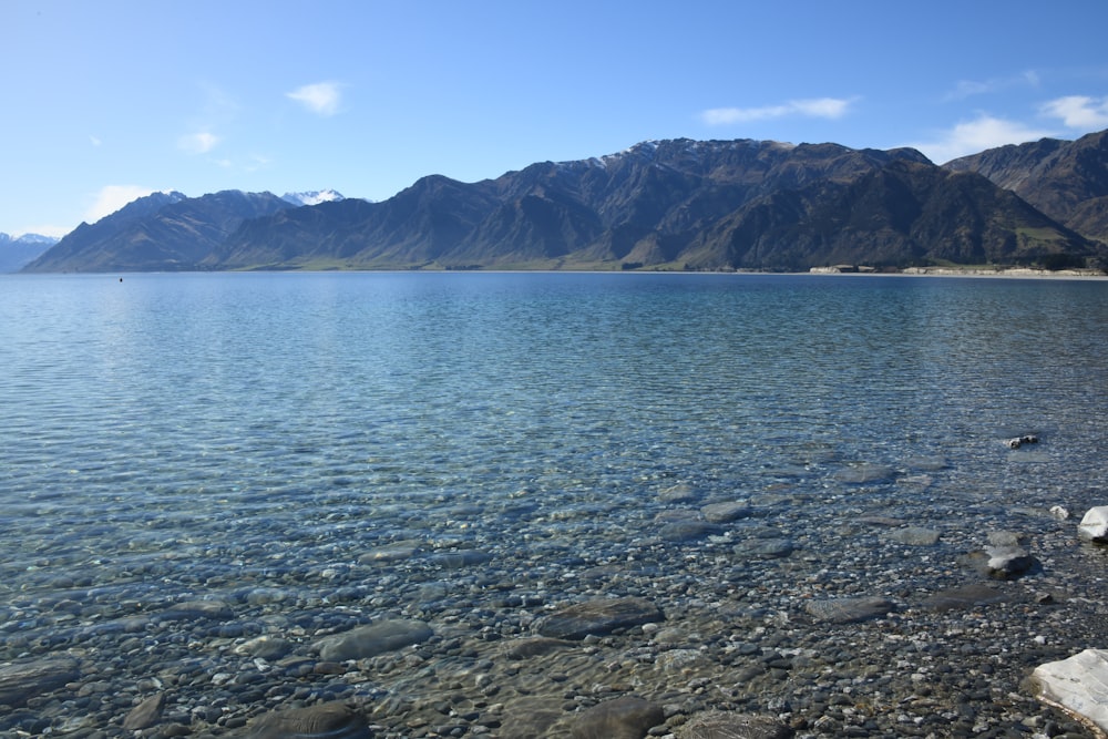 a large body of water surrounded by mountains