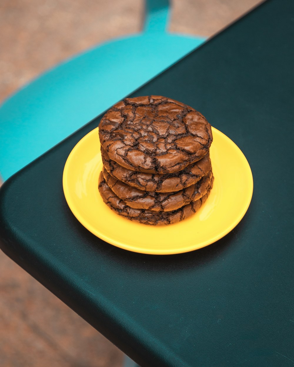 a stack of cookies sitting on top of a yellow plate
