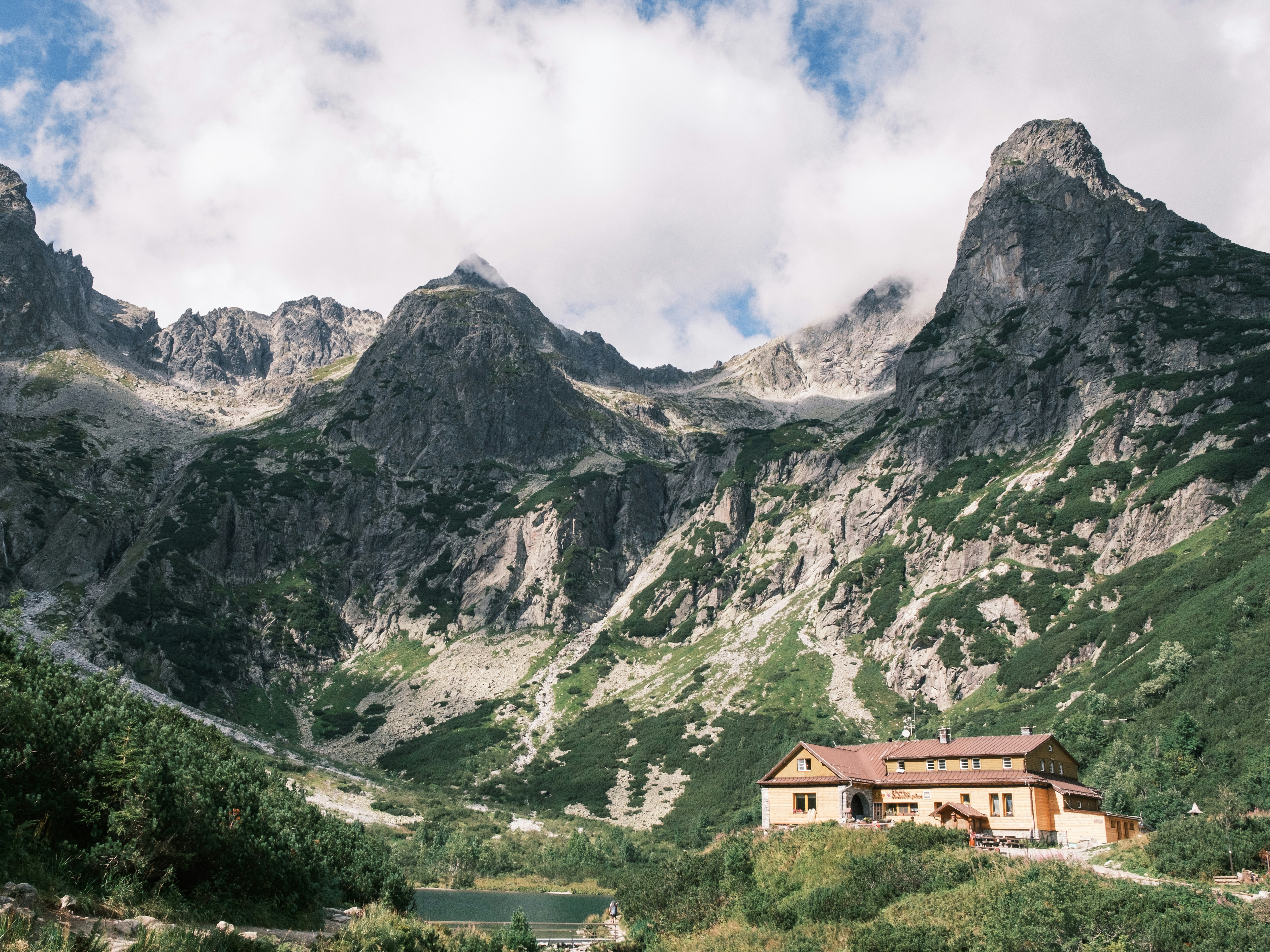 a house in the middle of a mountain range