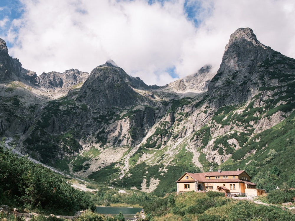 a house in the middle of a mountain range