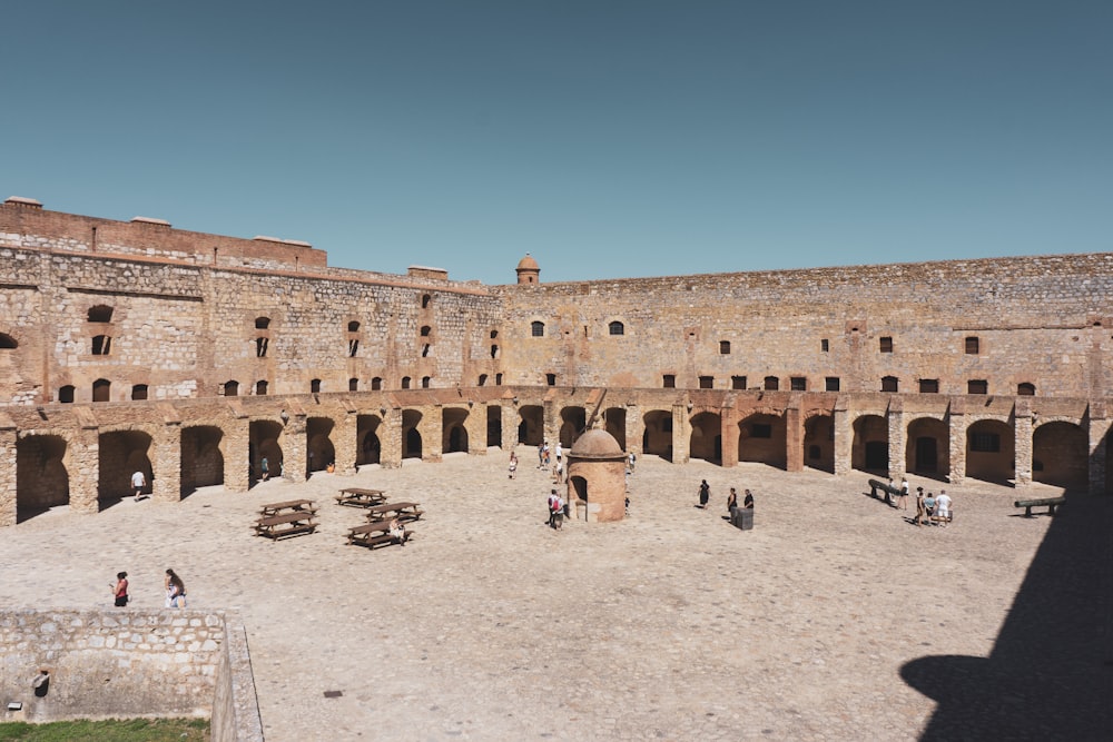 a group of people standing around a courtyard